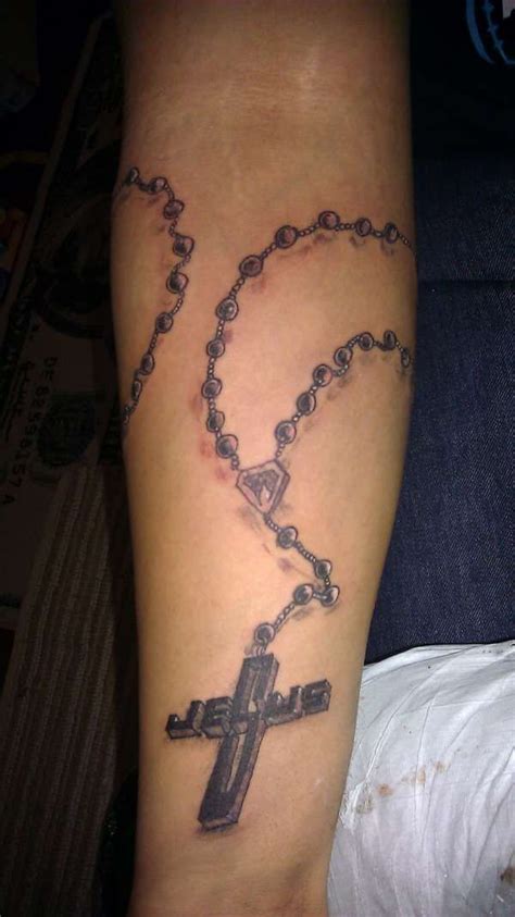 Black ink anchor with chain and banner tattoo design for sleeve. Jesus cross and beads tattoo | Cross necklace tattoo ...