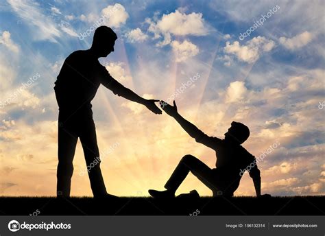 Silhouette Man Giving Helping Hand Another Man Who Fell Ground Royalty