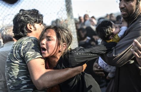 Syrian Refugees Crash Through Turkish Border Fence The Atlantic