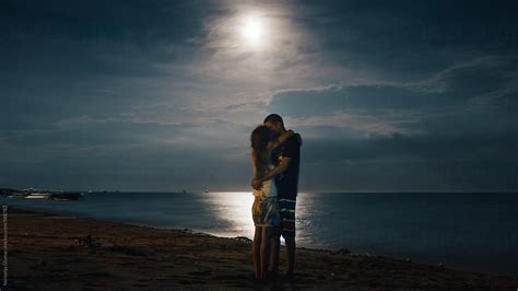 Romantic Couple Kissing Under The Full Moon By Nemanja Glumac