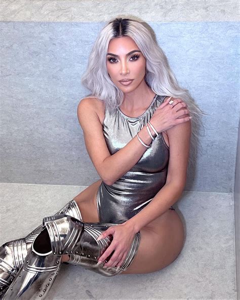Kim Kardashian Poses In Just A Silver Bodysuit And Thigh High Boots In