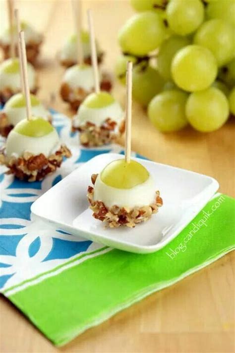 Grapes Dipped In White Chocolate Rolled In Nuts Then Chilled And Serve