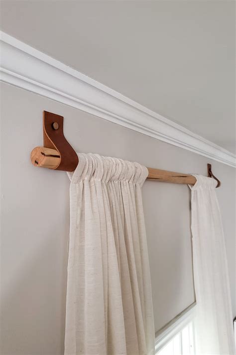 Great for extra large and bay windows. DIY Wood Curtain Rods with Leather Straps for Under $10 ...