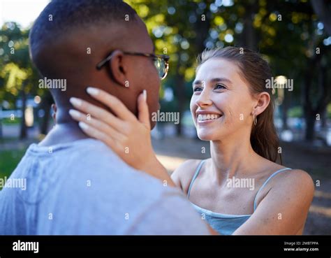 love interracial or couple of friends in a park bonding on a romantic date in nature in a