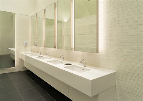 Row Of White Modern Marble Ceramic Wash Basin In Public Toilet