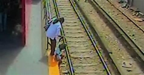 Mom Lowers Daughter Onto Train Tracks Cbs News
