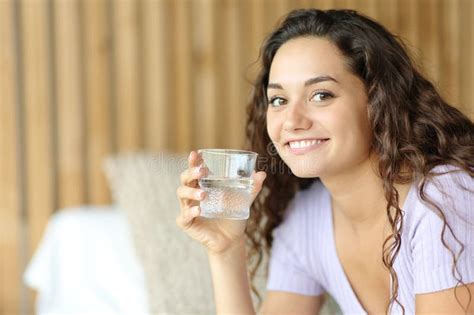 Happy Woman Holding Water Glass Looks At You Stock Photo Image Of