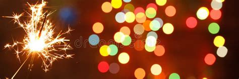 Beautiful Sparklers On The Background Of A Garland Beautiful Banner