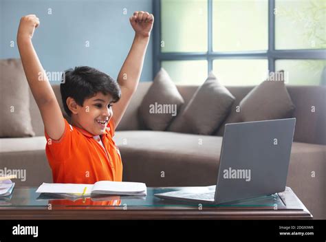 A Young Boy Actively Participating In Online Class Stock Photo Alamy