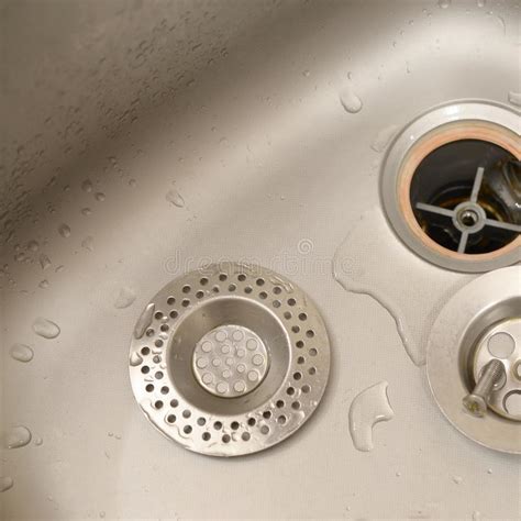 How to tighten a loose kitchen sink faucet. Silvery Kitchen Sink With A Disassembled Protective Filter ...