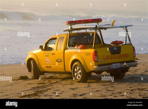 Los Angeles County Lifeguard Watching Big Waves From His Truck At Zuma Beach Malibu Los Angeles