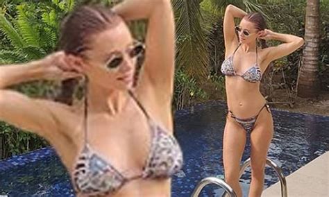 Una Healy Poses In A Bikini Poolside During Refreshing Getaway In