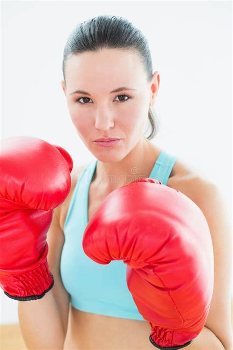 Close Up Portrait Of A Beautiful Woman In Red Boxing Gloves Stock Image