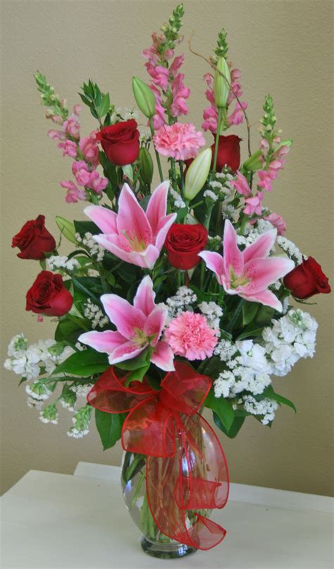 A Romantic Red White And Pink Flower Arrangement By Your Local River