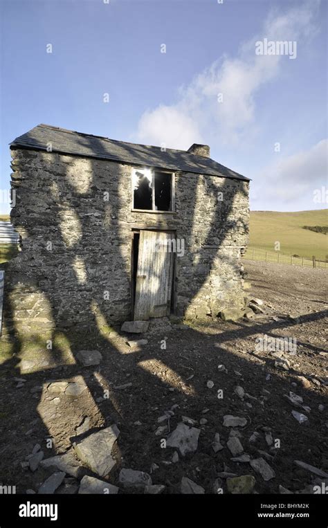 Welsh Eerie Barn With Tree Shadows Stock Photo Alamy