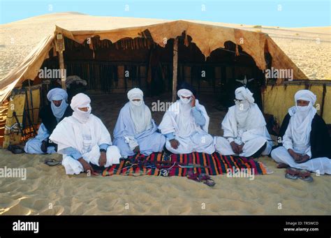 Tuaregs With Litham In Front Of A Tent In The Sahara Libya 2 4 Stock