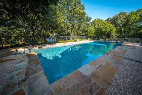 The shade from the large trees and the waterfall feature from the negative edge creates a park like atmosphere that seems like it has been there for decades. Rejuvenate - Allison Landscpe & Pool Company
