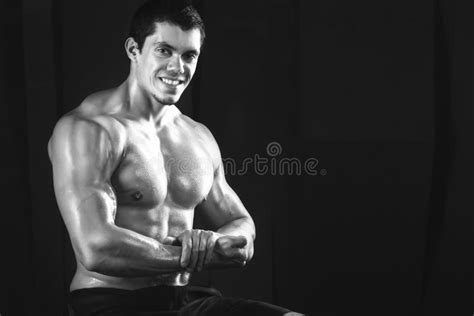 Muscular Young Man In A Studio Portrait Of Strong Brutal Guy Stock