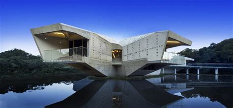 Futuristic Concrete House With Bridge Access And Eco Appeal
