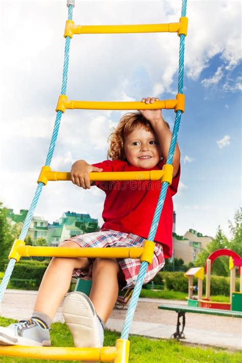 Boy Climbing On Rope Ladder Stock Photo Image Of Happiness Park