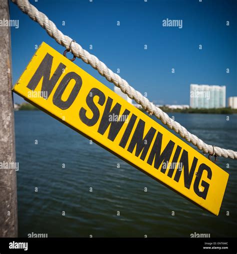 No Swimming Sign On Wooden Tablet Near Lagoon Stock Photo Alamy