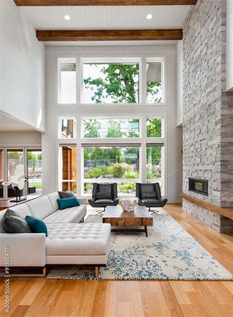 Beautiful Living Room With Vaulted Ceiling Bank Of Windows Hardwood
