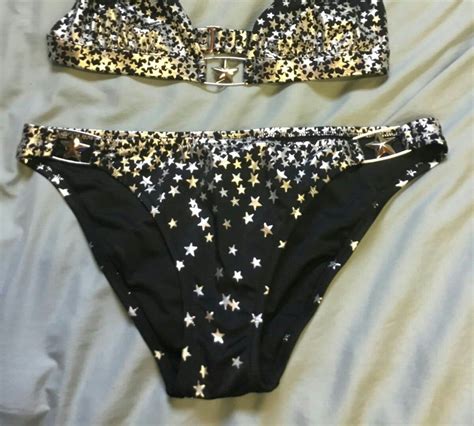 Black With Silver Stars Top Is A Halter Ties At The Back Bikinis