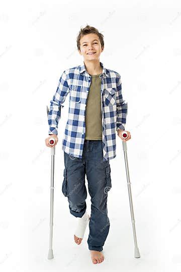 Teenage Boy With Crutches And A Bandage On His Right Leg Stock Image