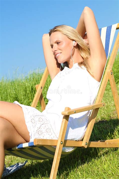 Blond Girl Chilling In A Sunchair Stock Image Image Of Music Girl 15548723