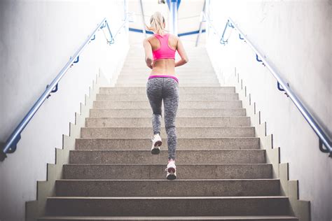 Sporty Woman Running On The Stairs