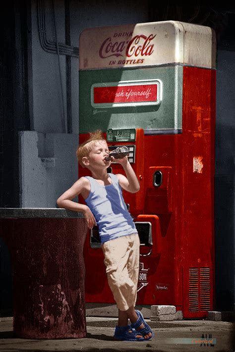 Boy Drinking A Coke Dispensed From A Vending Machine Ca 1970s