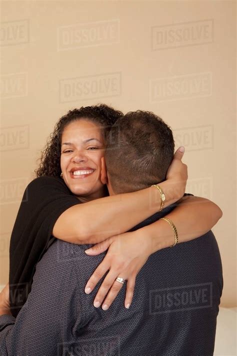 Wife Hugging Her Husband Stock Photo Dissolve