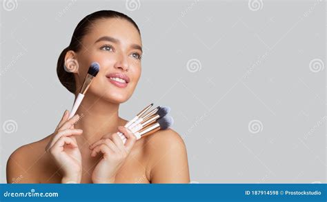 Caucasian Young Woman Holding Her Makeup Brushes Stock Photo Image Of