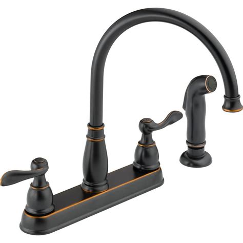 Other notable highlights include the one lever handle and side spray handle. Delta Windemere 2-Handle Standard Kitchen Faucet with Side ...