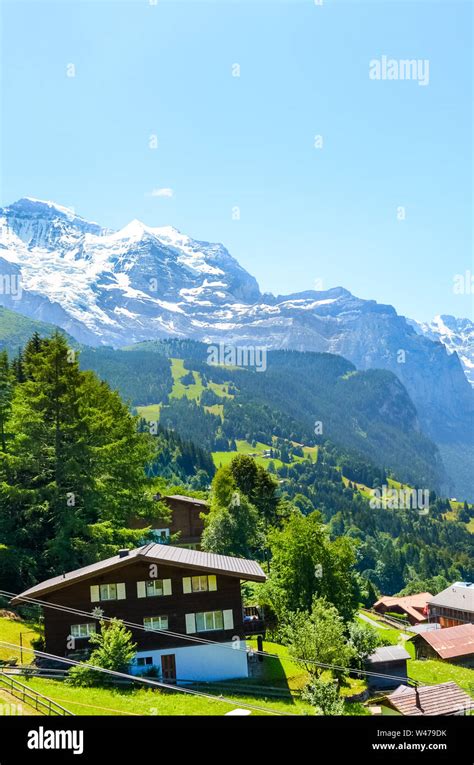 Stunning Village Wengen In Swiss Alps Mountain Ridges With Snow On Top