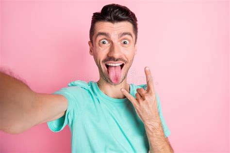 Photo Of Young Funny Cheerful Crazy Man Stick Tongue Out Take Selfie