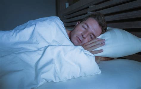 man sleeping peacefully with oral appliance from sleep dentist fort worth snoring and sleep