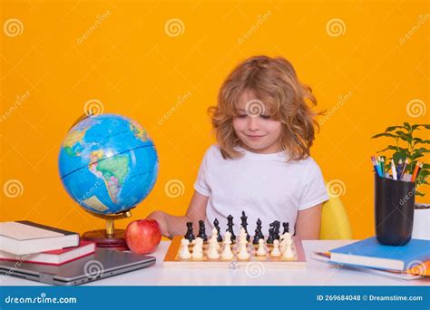 Kid Playing Chess Child Thinking Near Chessboard Learning And Growing