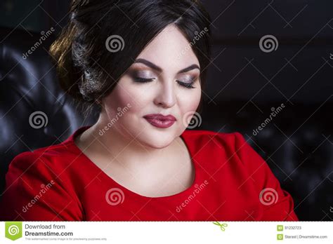 Plus Size Fashion Model In Red Dress With Professional Make Up And