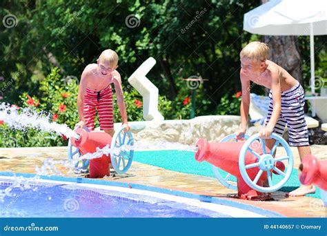 Two Happy Brothers Having Fun In Aqua Park Stock Image Image Of