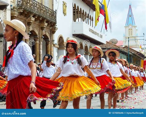 cuenca ecuador group of girls dancers dressed in colorful costumes as cuencanas at the parade