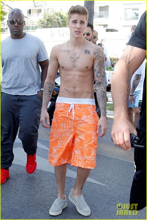 Justin Bieber Displays Shirtless Six Pack While Walking Through Cannes