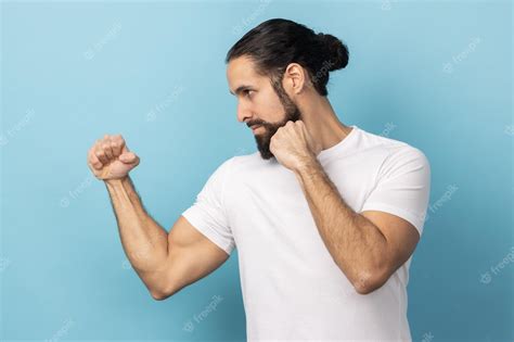 Premium Photo Side View Of Aggressive Man With Beard Wearing Tshirt