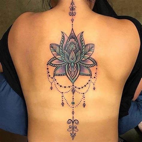 mandala tattoo meaning colourful lotus back tattoo black top blue cushions spine tattoos
