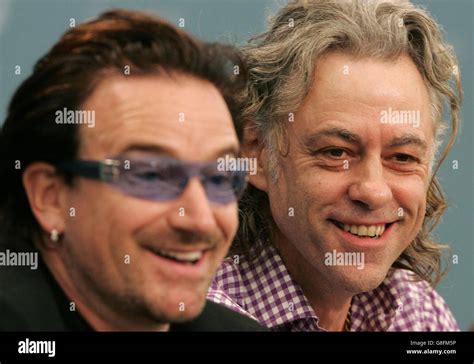pop stars and anti poverty campaigners bob geldof r and bono share a joke at a press