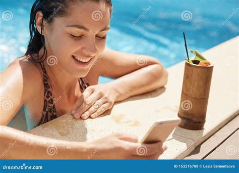 Happy Woman Having Fun At Luxury Resort Female Drinking Fresh Cocktail While Being Near Edge Of