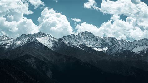 Download Wallpaper 1366x768 Mountains Peaks Clouds Snowy Landscape