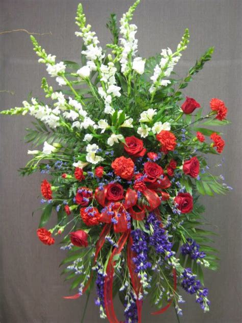 This is because they represent everlasting love. Red, white and blue standing funeral flower tribute. # ...