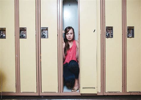 Scared High Babe Babe Hiding Inside Locker By Stocksy Contributor Rob And Julia Campbell