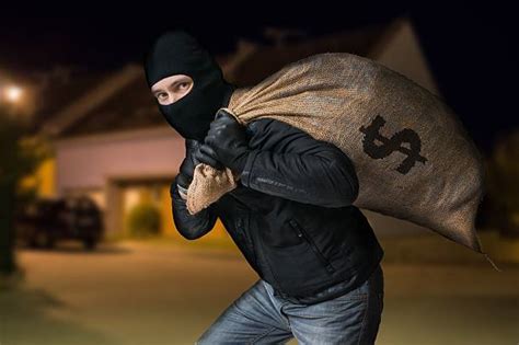 210 Robber Carrying A Bag Of Dollars Stock Photos Pictures And Royalty